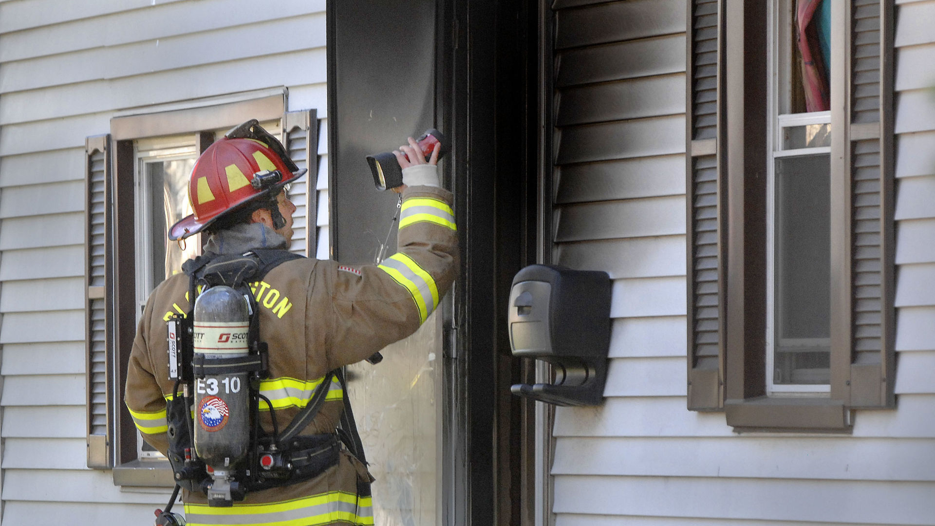 One in custody after house fire